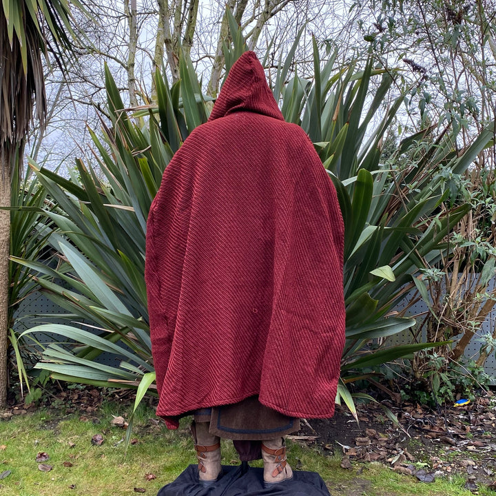 The Four Way LARP Cloak in Red Herringbone Wool with Reversable Brown Faux Fur & Leather Brown Mantle is a Versatile Cape with Hood. The Medieval Cloak is Water Resistant and helps keep you warm. The Viking Style Cloak can be worn in four ways; perfect for your LARP character, Cosplay Events, and Ren Faires. 