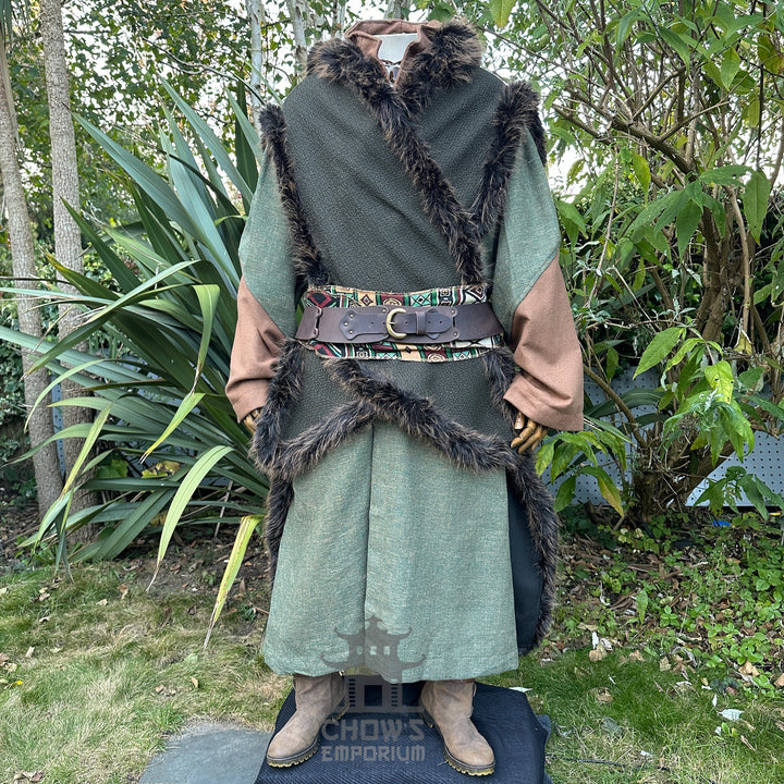 Medieval LARP costume front view, featuring a green faux fur trim hooded cape, high collared robe, leather belt, sash and necklace. For Renaissance Faire and historical roleplay events.