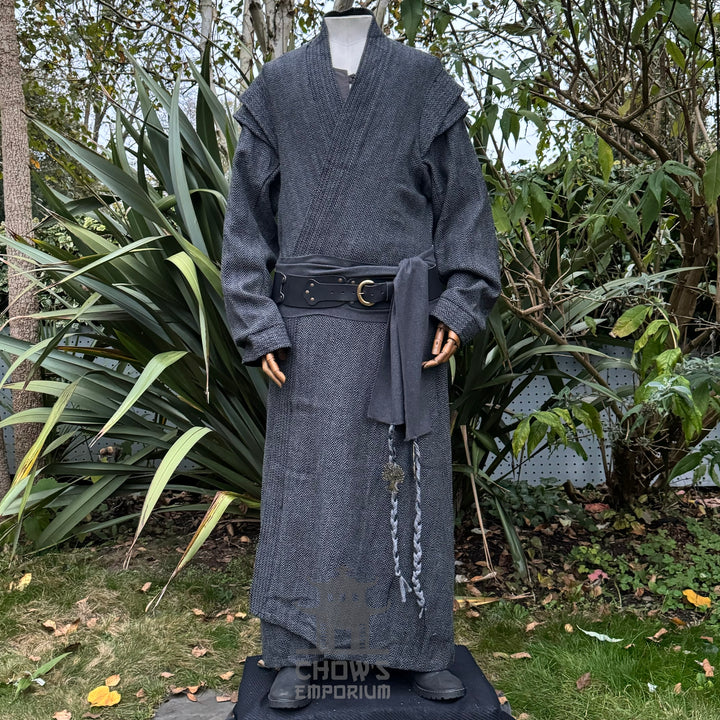 Medieval LARP costume front view, featuring a grey full length robe, black leather belt and grey sash. For Renaissance Faire and historical roleplay events.