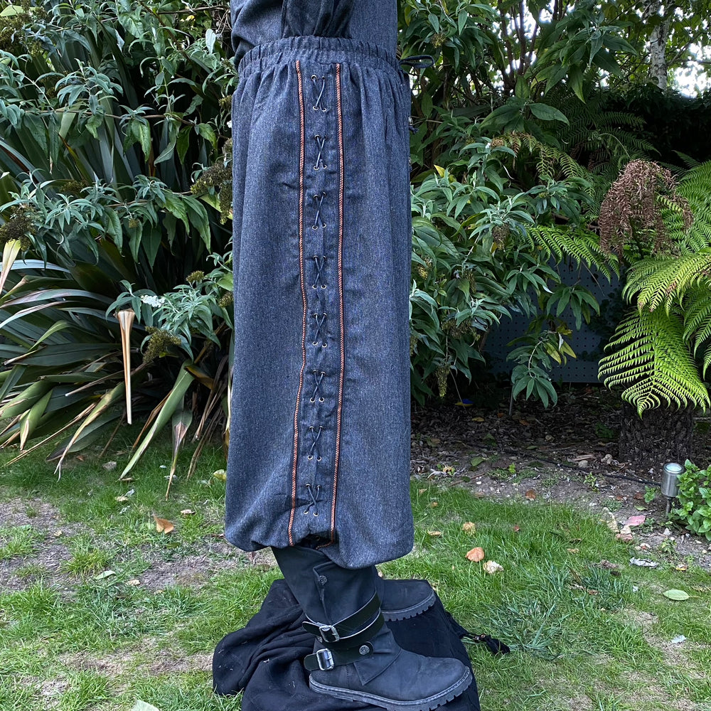grey wool hero pants with braided trim and side lacing
