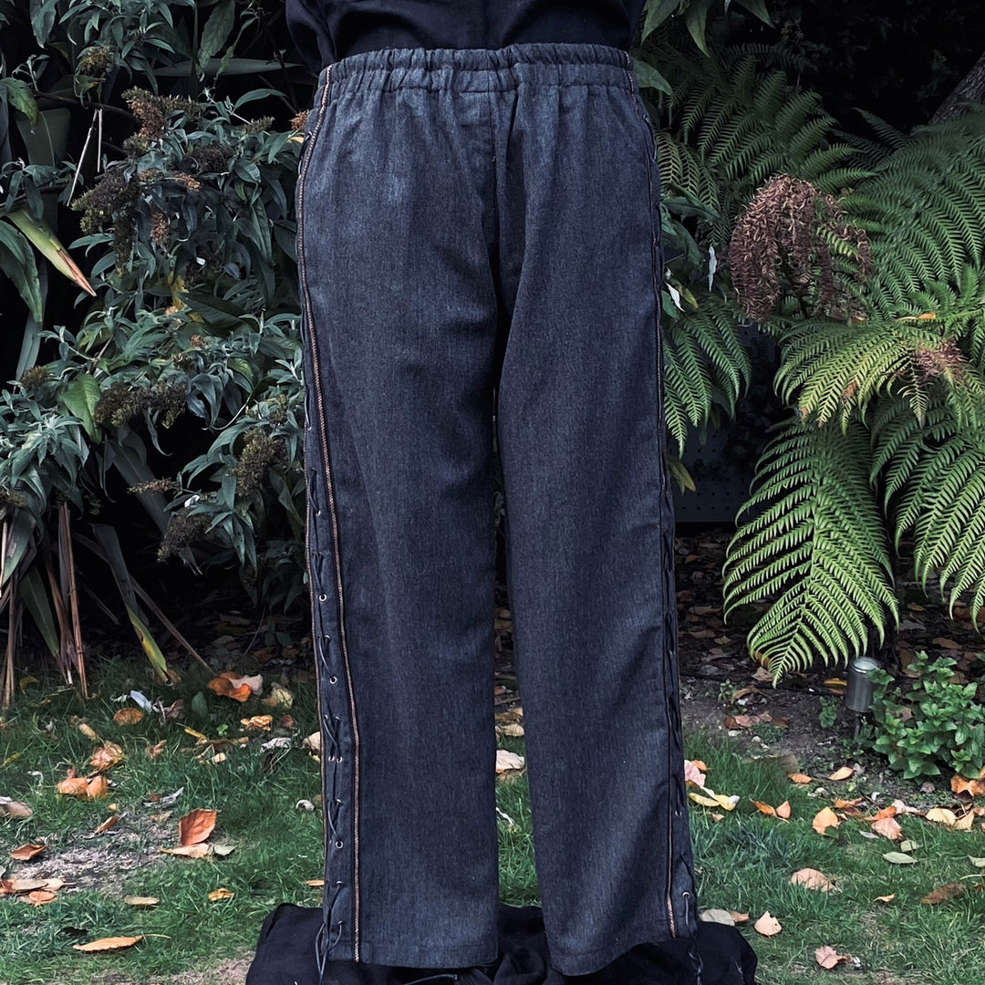 Back view of grey straight-leg LARP trousers showing elastic waistband and relaxed fit