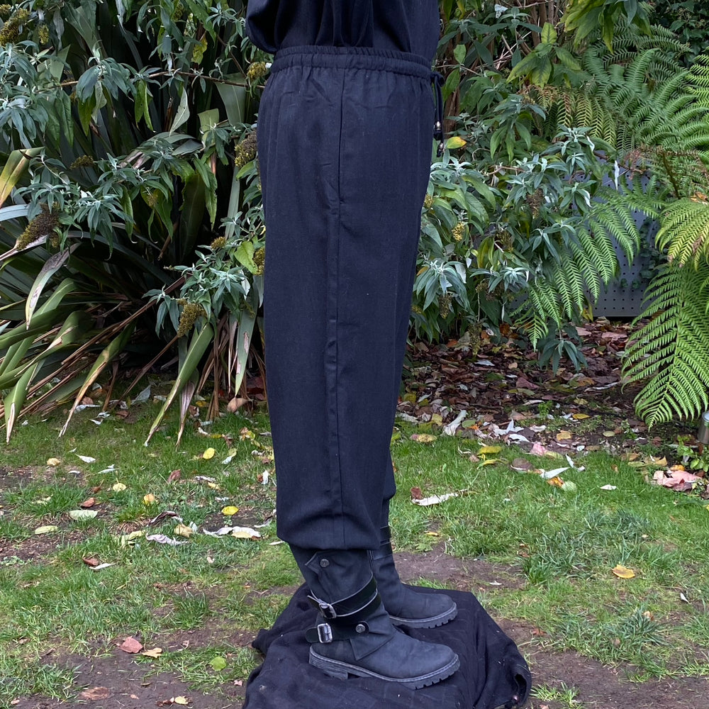 straight-leg medieval trousers in black wool fabric