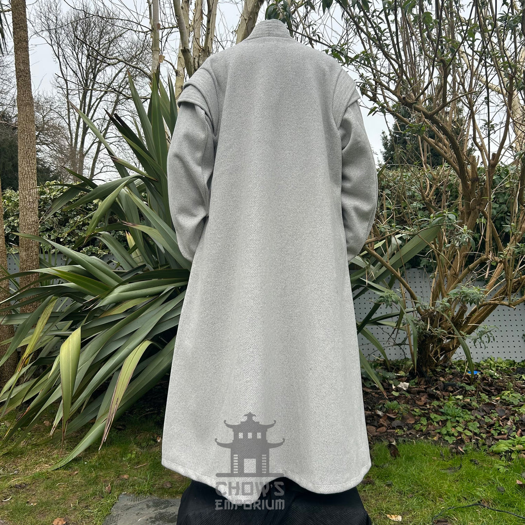 Back view of light grey medieval LARP robe with brown belt, fantasy cosplay costume for roleplay or historical events.