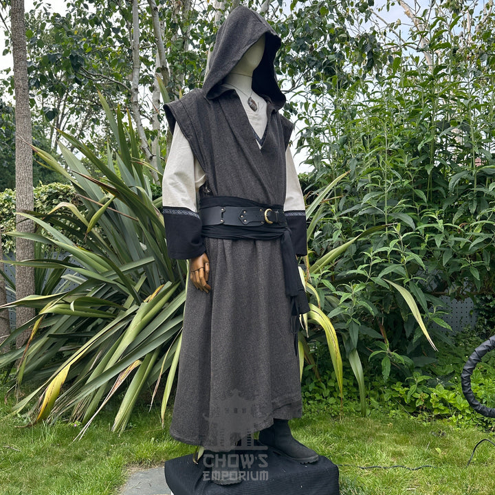 Medieval LARP costume side view featuring brown sleeveless robe, tunic, trousers, and sash. For Renaissance Faire and historical roleplay events.
