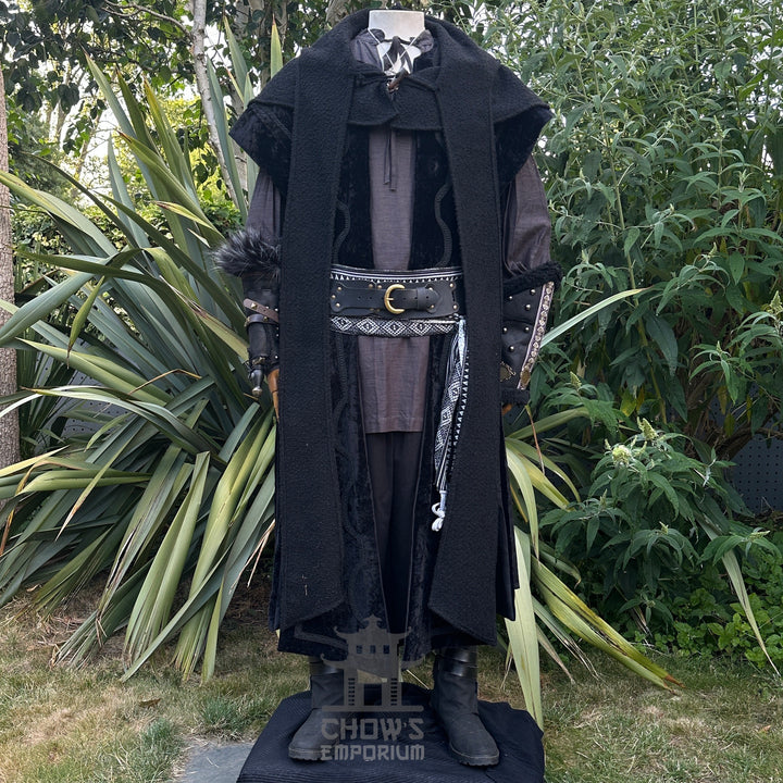 Medieval LARP costume front view featuring waistcoat, hood, vambraces, shirt, trousers, and sash. For Renaissance Faire and historical roleplay events.
