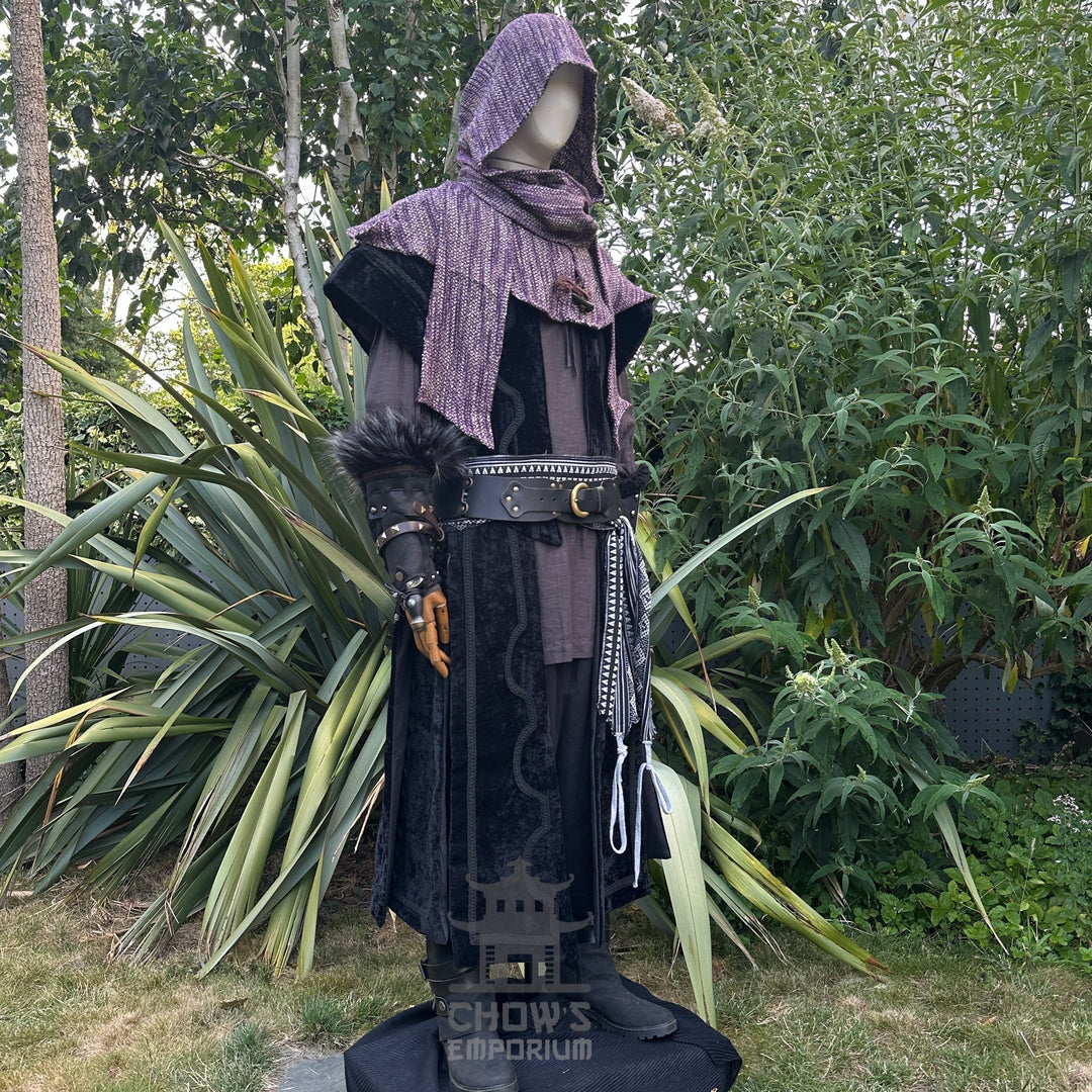 Medieval LARP costume side view featuring waistcoat, hood, vambraces, shirt, and sash. For Renaissance Faire and historical roleplay events.