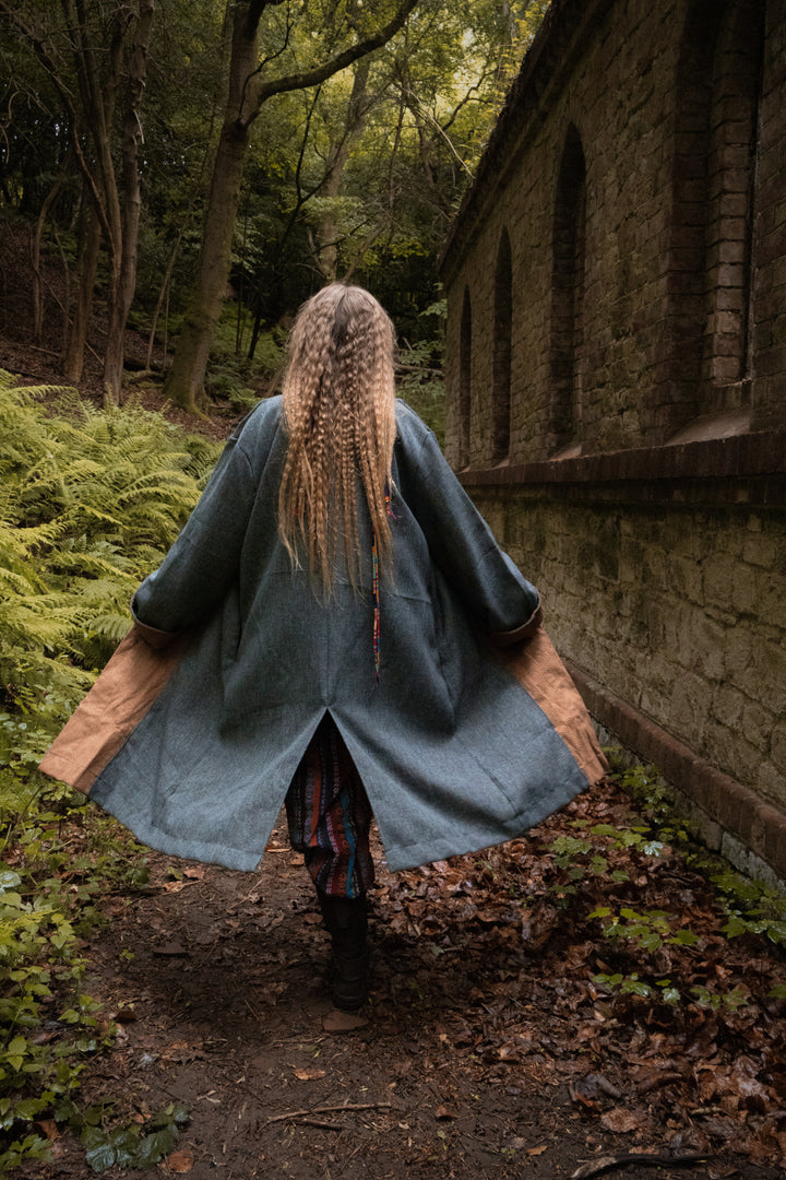 Outdoor angled view of teal and brown pirate LARP coat, medieval fantasy cosplay costume for roleplay and Renaissance Faire events.