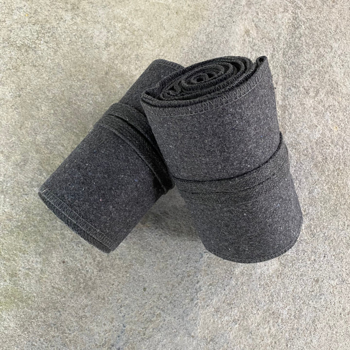 Set of Medieval LARPing Leg Wraps. They are Dark Grey and made out of a Wool mixture which are used to keep Trouser flares out of the way and legs warm. These Viking Wraps can wrap around your Legs to provide an extra flare to LARP kit.