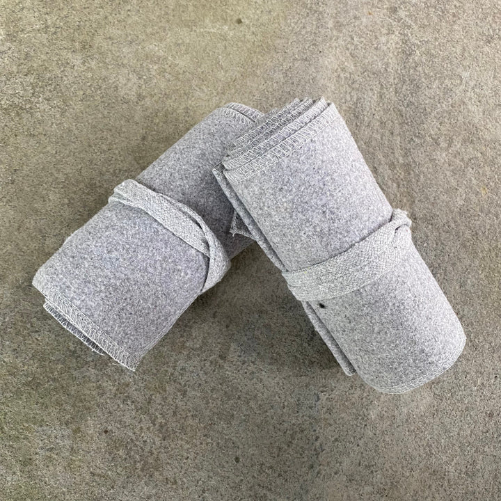 Set of Medieval LARPing Leg Wraps. They are White and made out of a Wool mixture which are used to keep Trouser flares out of the way and legs warm. These Viking Wraps can wrap around your Legs to provide an extra flare to LARP kit.