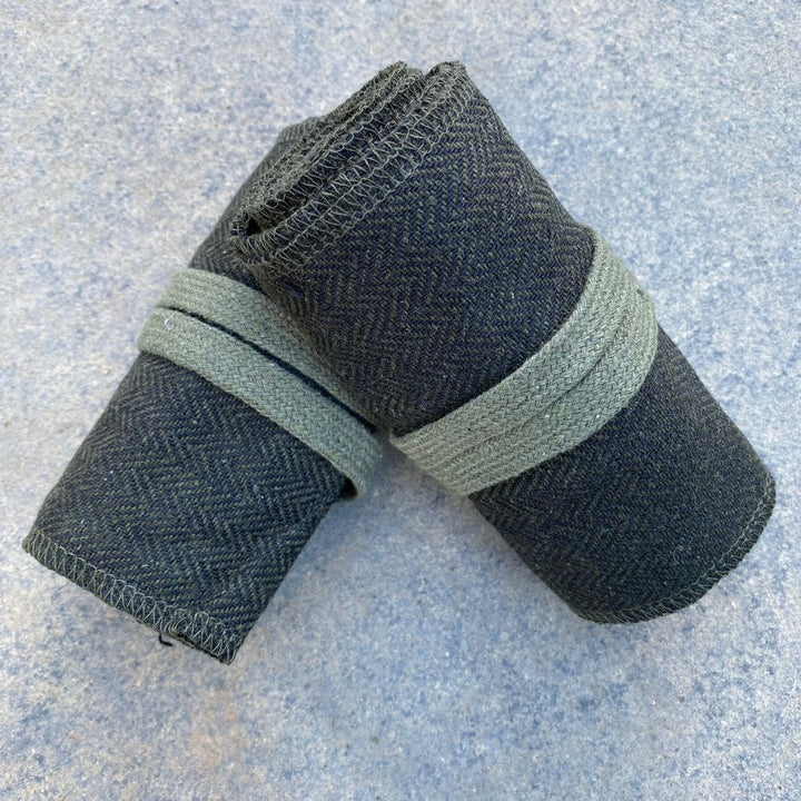 Set of Medieval LARPing Leg Wraps. They are Green & Black and made out of a Herringbone Wool mixture which are used to keep Trouser flares out of the way and legs warm. These Viking Wraps can wrap around your Legs to provide extra flare to LARP kit.