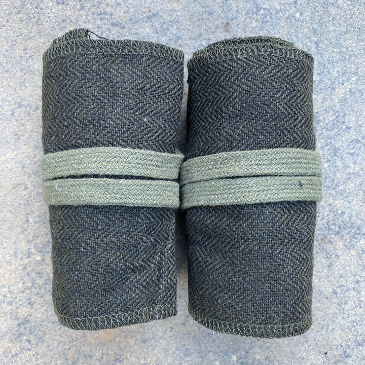 Set of Medieval LARPing Leg Wraps. They are Green & Black and made out of a Herringbone Wool mixture which are used to keep Trouser flares out of the way and legs warm. These Viking Wraps can wrap around your Legs to provide extra flare to LARP kit.