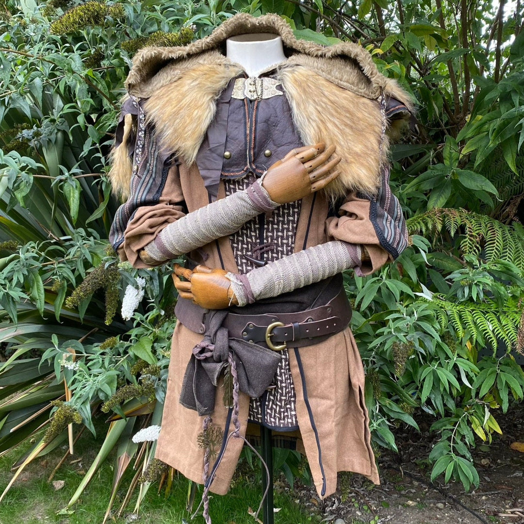 Set of Medieval LARPing Arm Wraps. They are coloured Light Brown and made out of a Herringbone Wool mixture which are used to keep sleeves out of the way and arms warm. These Viking Arm Warps are 59 inches long, and can wrap around your forearms to provide a flare for your LARP costume, Ren Faire costume, or Cosplay.