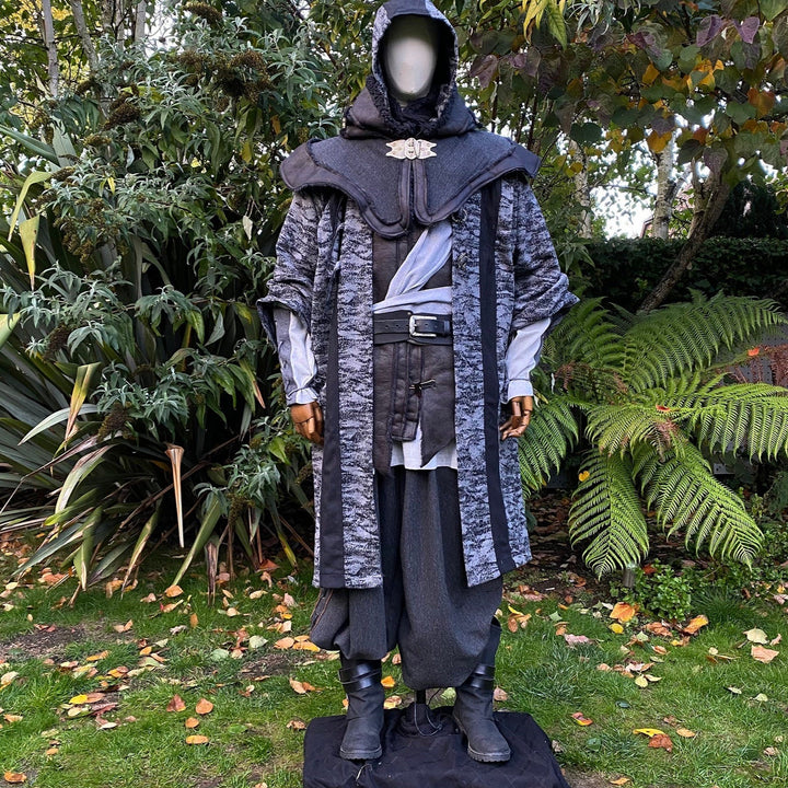 Medieval LARP costume front view, featuring faux leather hood and waistcoat, grey and black hooded robe, and a sash. For Renaissance Faire and historical roleplay events.