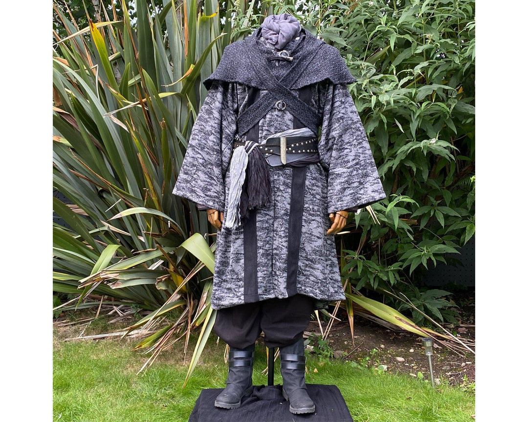 Medieval LARP costume front view, featuring grey and black hooded robe, and a grey woollen wraparound hood. For Ren Faire and historical roleplay events.