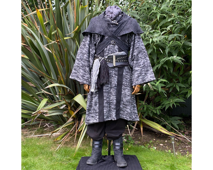 Medieval LARP costume front view, featuring grey and black hooded robe, and a grey woollen wraparound hood. For Ren Faire and historical roleplay events.