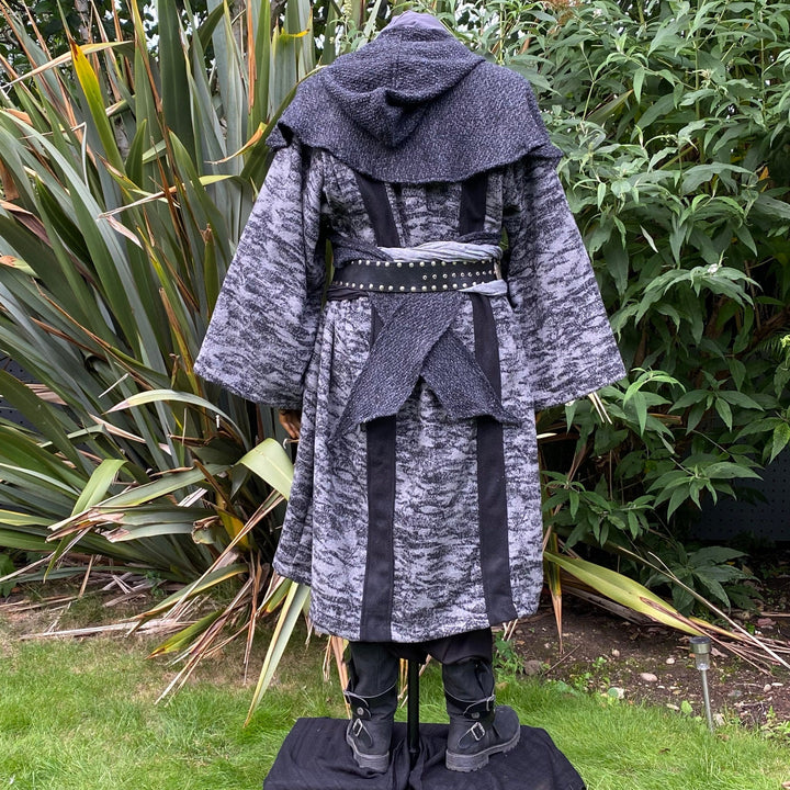 Medieval LARP costume back view, featuring grey and black hooded robe, and a grey woollen wraparound hood. For Ren Faire and historical roleplay events.