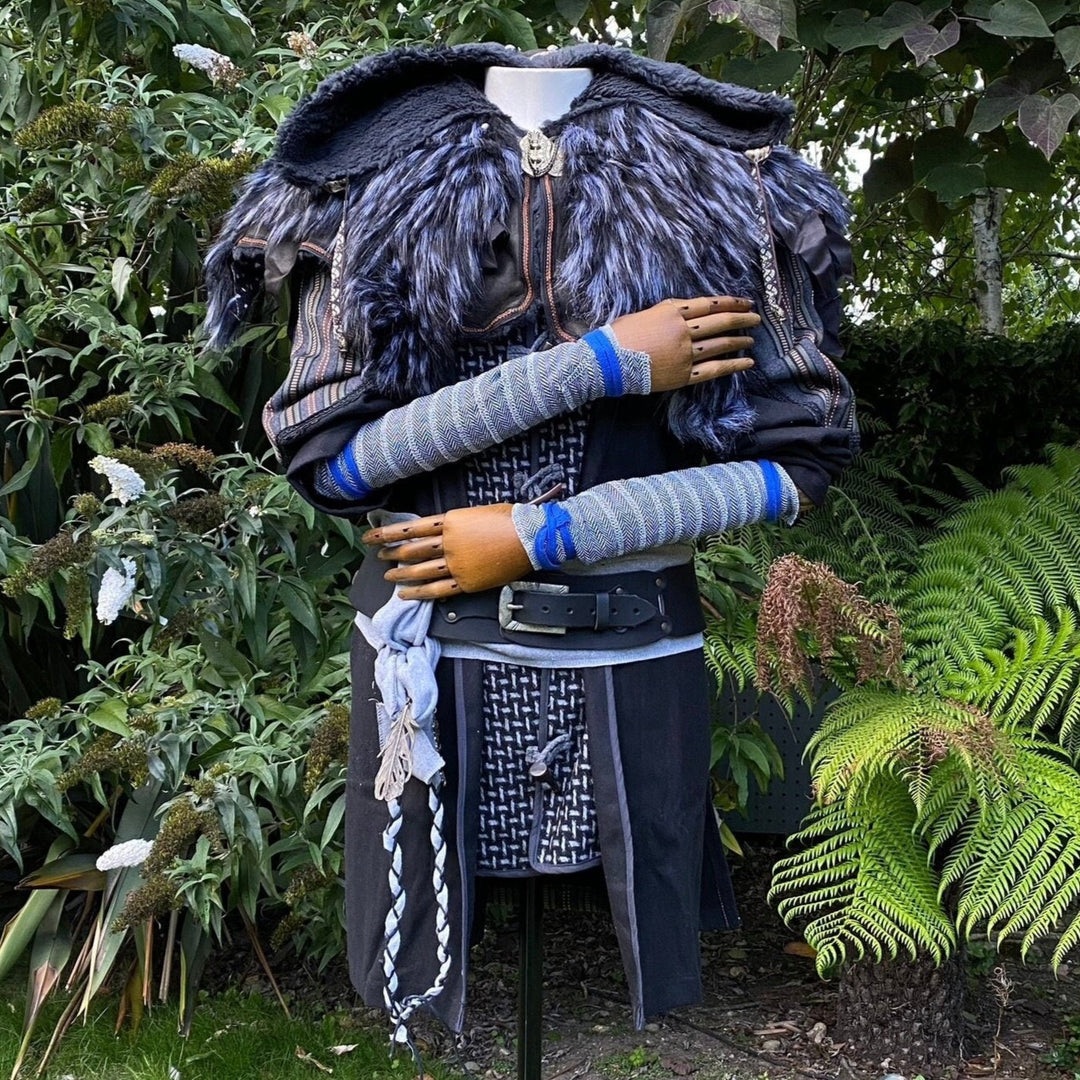 Set of Medieval LARPing Arm Wraps. They are coloured Blue & White and made out of a Herringbone Wool mixture which is used to keep sleeves out of the way and arms warm. These Viking Arm Warps are 59 inches long, and can wrap around your arms to provide extra flare for your LARP costume, Ren Faire costume, or Cosplay.