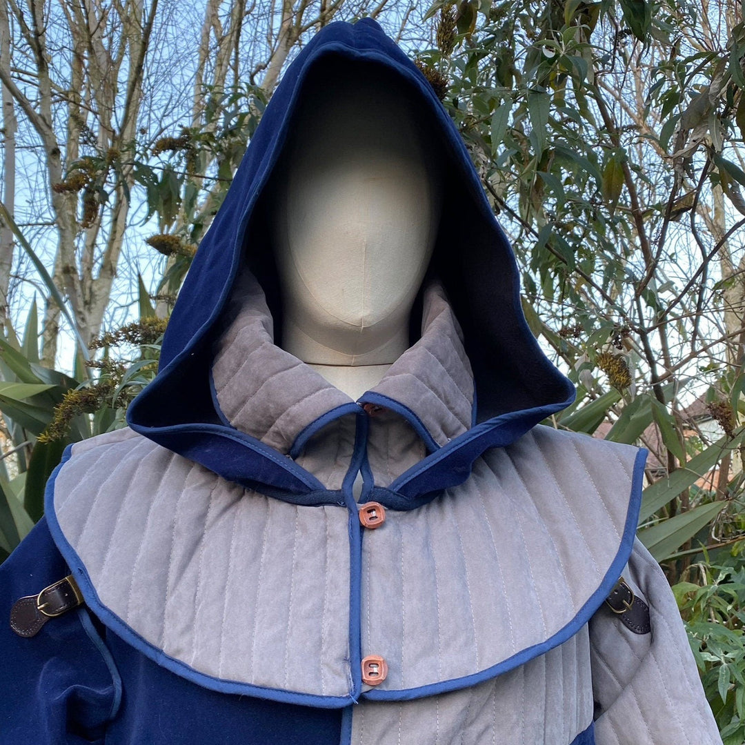 This Padded LARP Hood comes in Blue and Grey Faux Suede. This Viking Hood has a Snood style, and is Water Resistant. The Gambeson Mantle of the Medieval Hood keeps you warm and dry. Perfect for your LARP Character and LARP Costume, Cosplay Event, and Ren Faire.