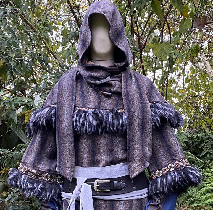 This LARP Hood in Blue & Grey Moahir Wool has Faux Fur Trimming in Black & Grey with Braiding. This Viking Hood is Water Resistant towards rain. The Medieval Hood covers your shoulders and provides warmth. Perfect for your LARP Character and LARP Costume, Cosplay Event, and Ren Faire.
