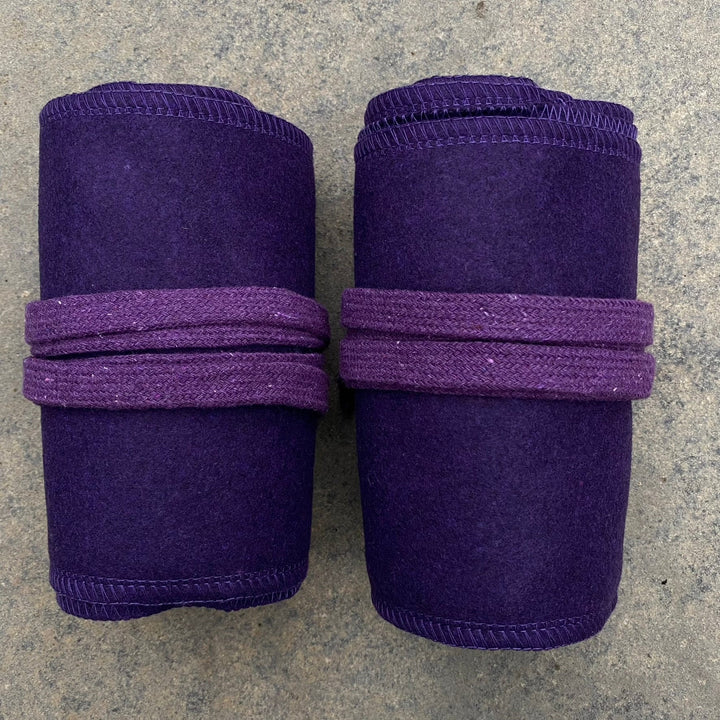 Set of Medieval LARPing Leg Wraps. They are Purple and made out of a Wool mixture which are used to keep Trouser flares out of the way and legs warm. These Viking Wraps can wrap around your Legs to provide an extra flare to LARP kit.