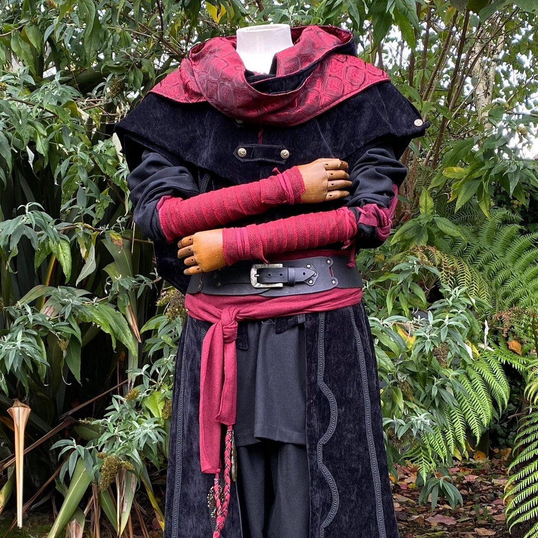 Set of Medieval LARPing Arm Wraps. They are coloured Red and made out of a Herringbone Wool mixture which are used to keep sleeves out of the way and forearms warm. These Viking Arm Warps are 59 inches long, and can wrap around your forearms to provide extra flare for your LARP costume, Ren Faire costume, or Cosplay.