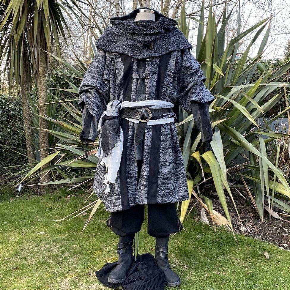 Medieval LARP costume front view, featuring grey and black hooded robe, wool hood, shirt and trousers. For Renaissance Faire and historical roleplay events.
