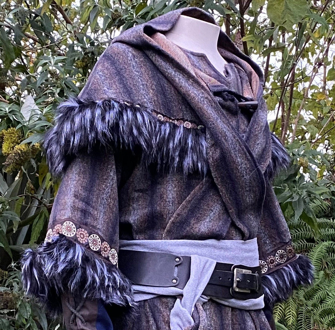 This LARP Hood in Blue & Grey Moahir Wool has Faux Fur Trimming in Black & Grey with Braiding. This Viking Hood is Water Resistant towards rain. The Medieval Hood covers your shoulders and provides warmth. Perfect for your LARP Character and LARP Costume, Cosplay Event, and Ren Faire.