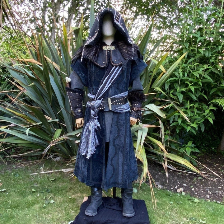 Medieval LARP costume front view featuring waistcoat, shirt, hood, vambraces, trousers, and accessories. For Renaissance Faire and historical roleplay events.