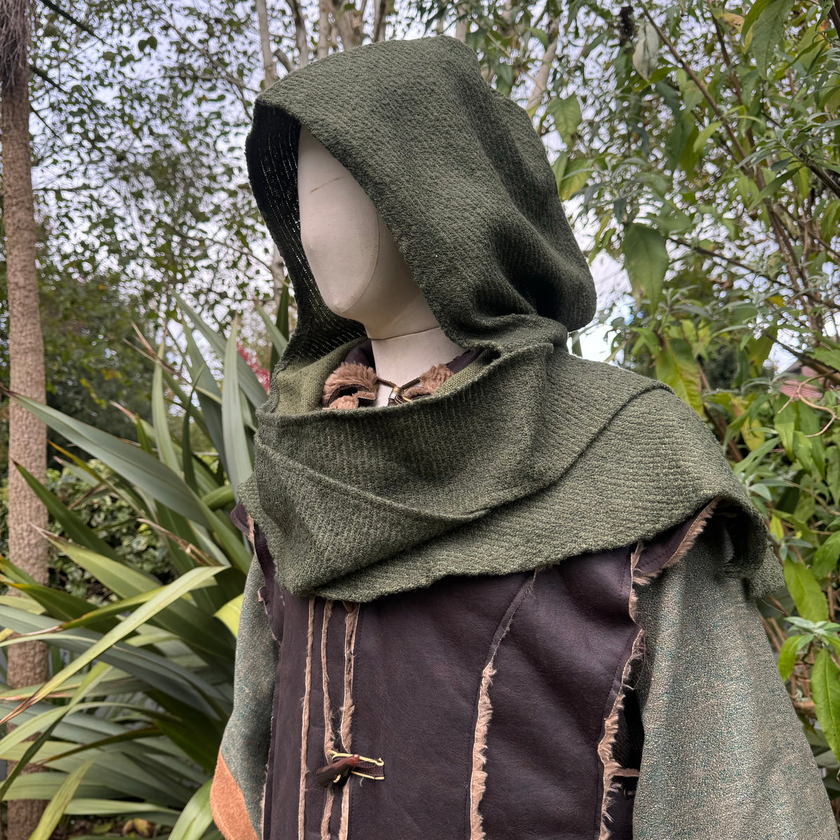 Green wool scarf hood for LARP, side angle, medieval style in natural setting.