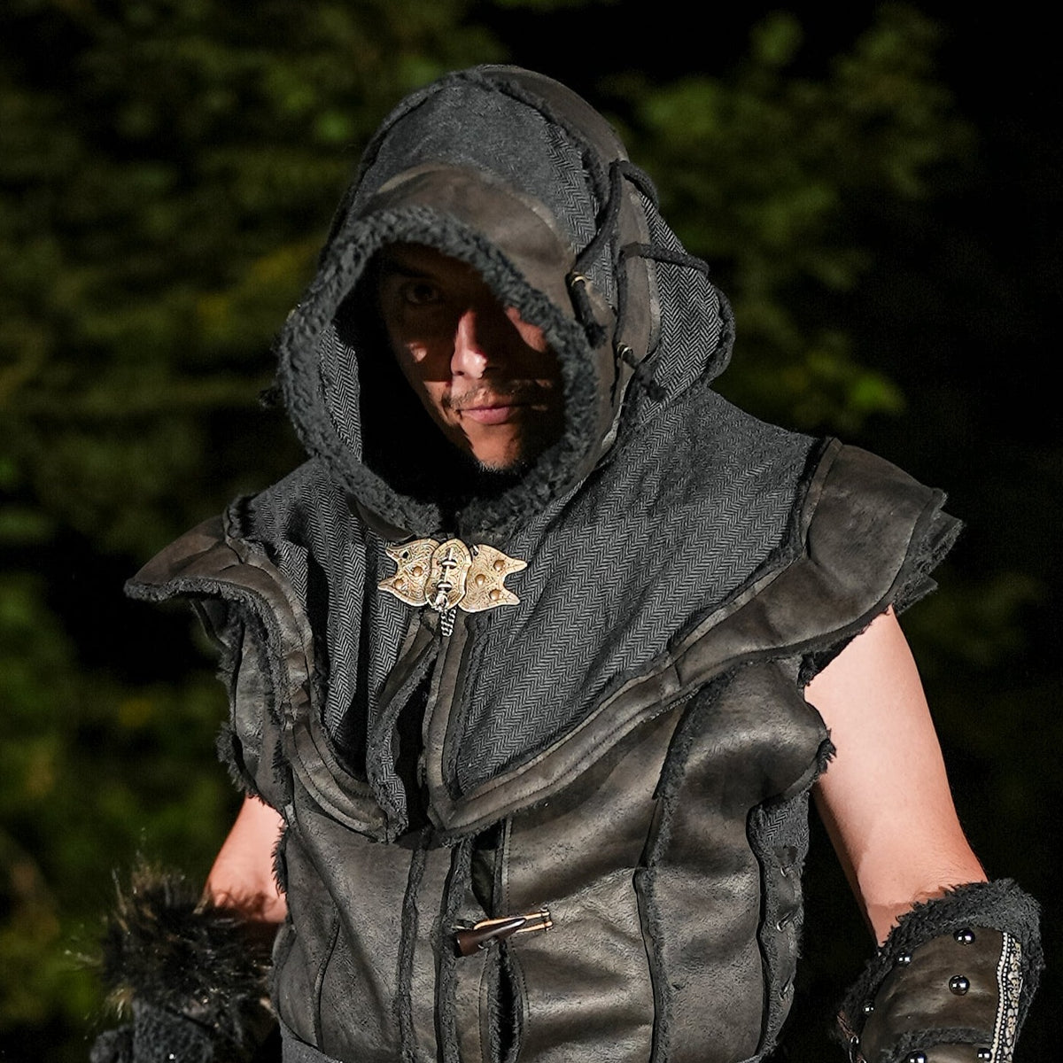 LARP hood in black faux leather, front view, with Viking-inspired clasp.
