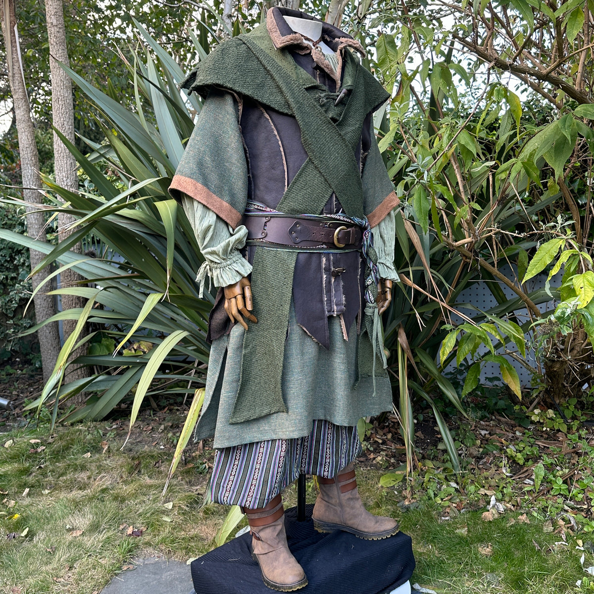 Green wool scarf hood on medieval costume, shown from front.