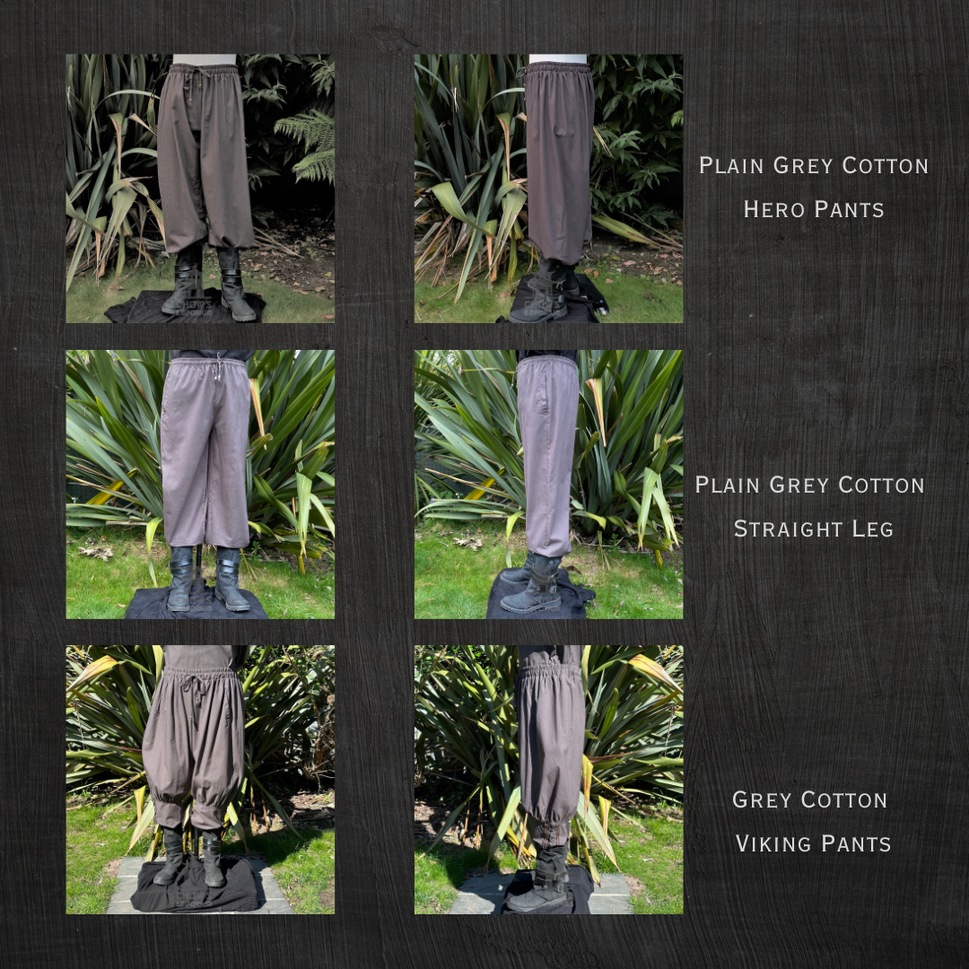 Profile view of loose grey medieval LARP pants under leafy backdrop.