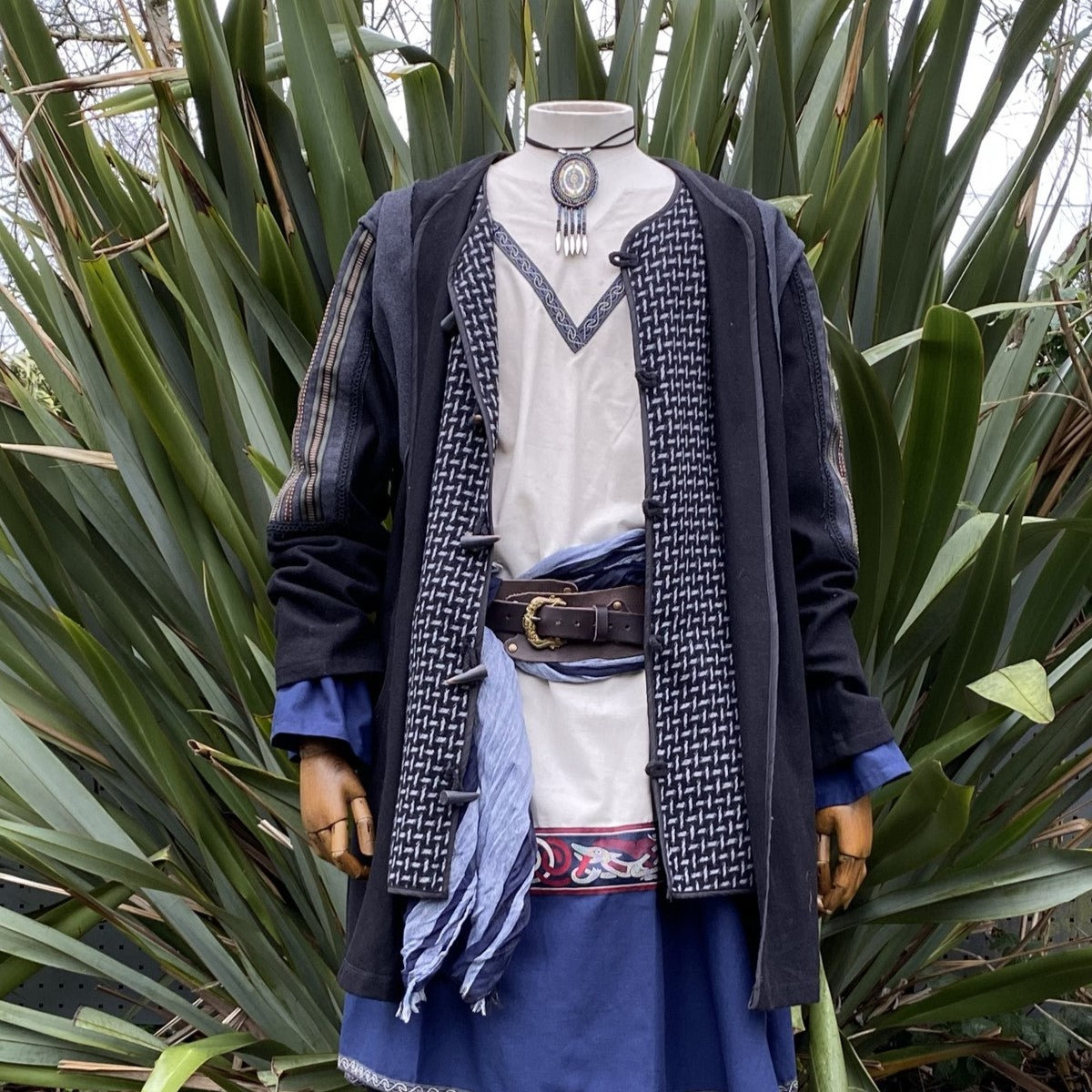Medieval LARP outfit; tunic front, blue accents, detailed belt design.