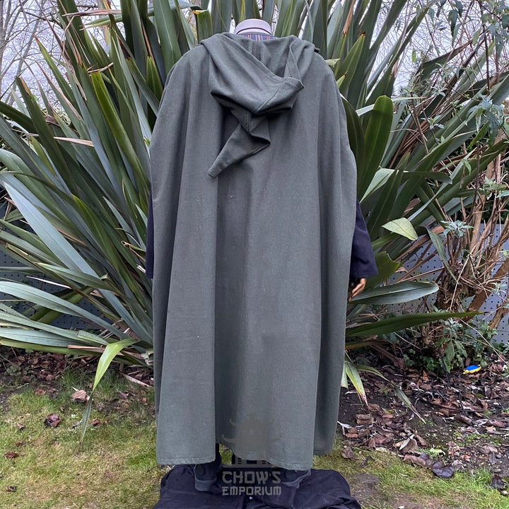 Medieval LARP outfit back view, featuring a green hooded cloak, jacket, tunic, trousers, belt and sash. For Renaissance Faire and historical roleplay events.