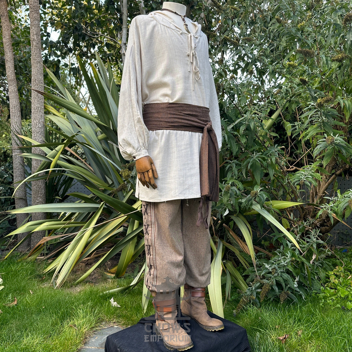 Medieval LARP outfit side view, featuring a hooded shirt, trousers, and sash.