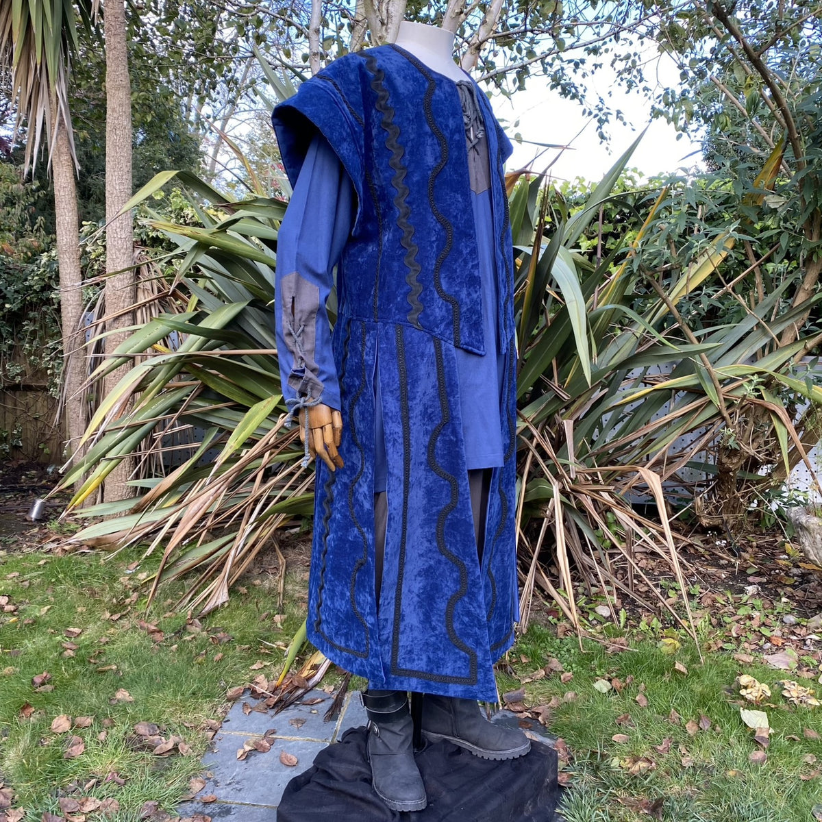 Side view of blue suede-effect medieval waistcoat with tailored fit for fantasy or cosplay outfits.