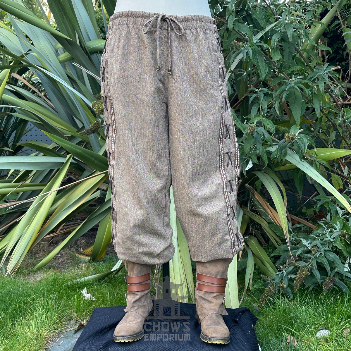straight-leg wool trousers with braiding trim and side lace detail.