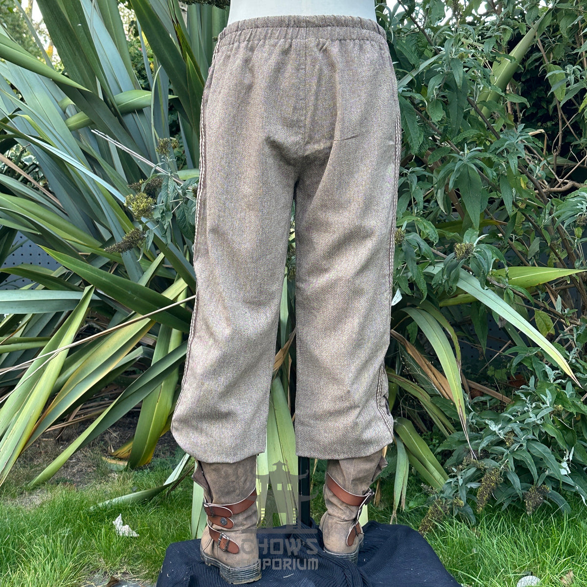 wool medieval trousers with side lace panels and braids.