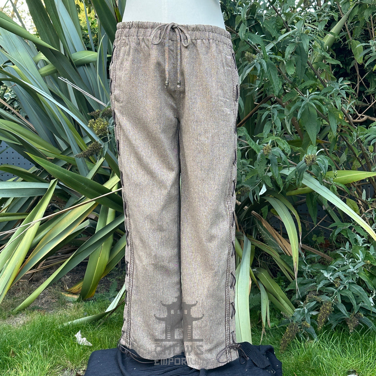 brown wool medieval pants with side lace and braiding front.