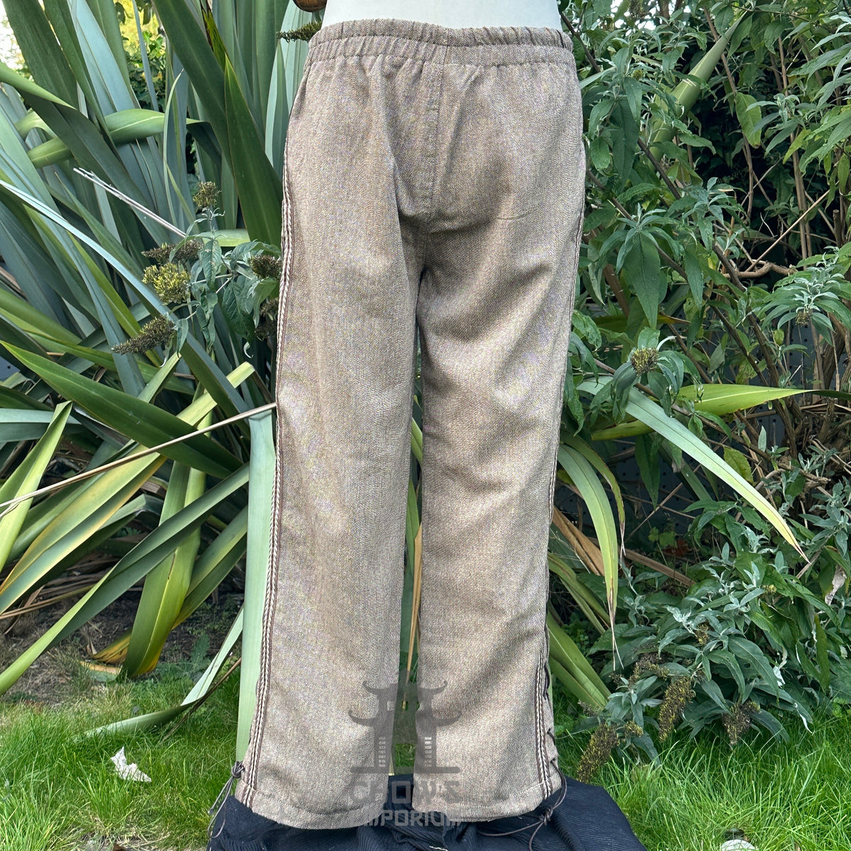 brown wool medieval pants with side lace and braiding back.