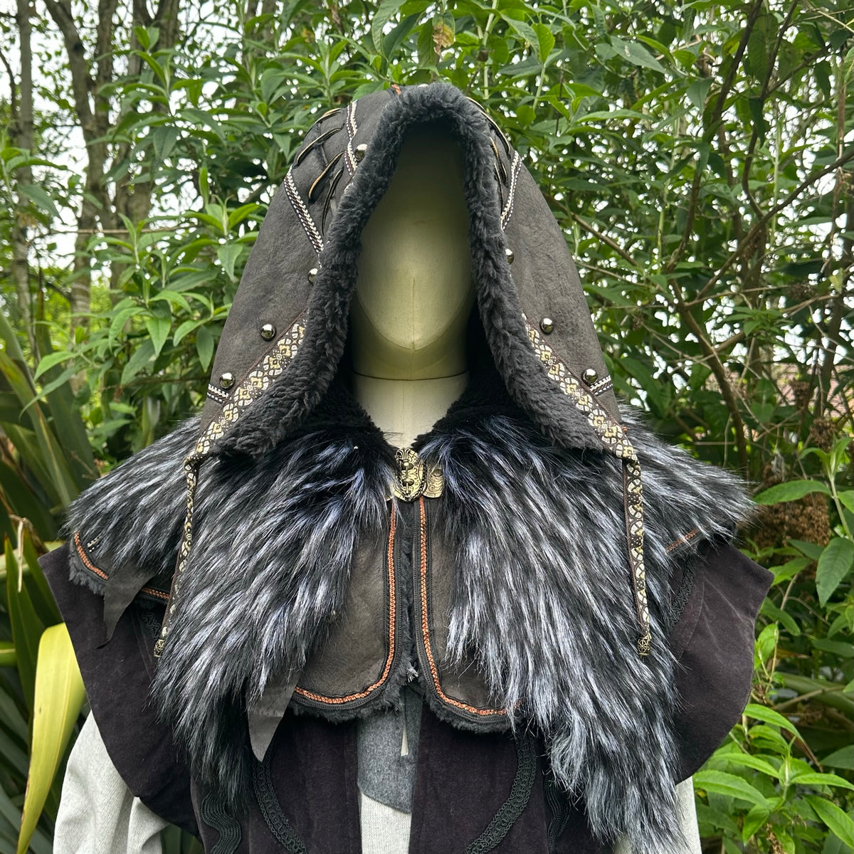 Dark grey ornate hood with faux fur trim, medieval LARP style, front view.