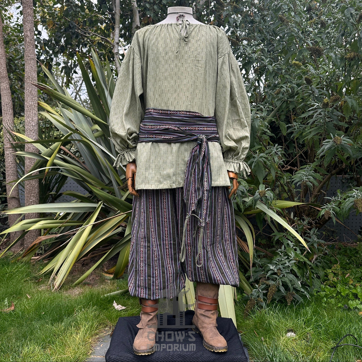 Medieval LARP outfit front view, featuring a green shirt, striped trousers and sash.
