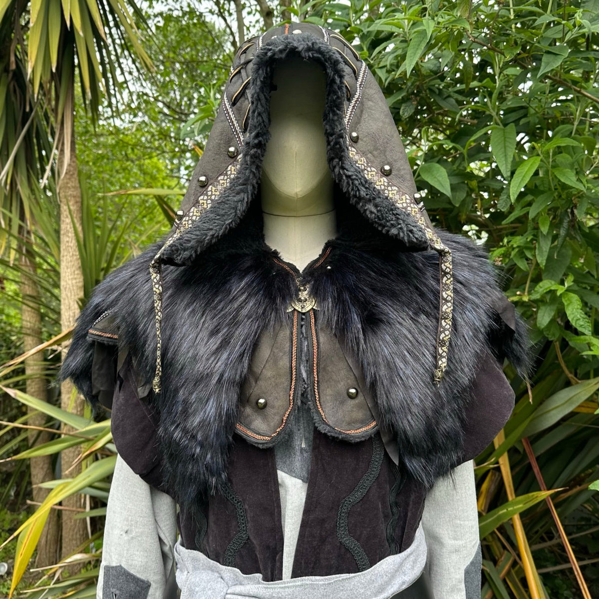 Dark medieval LARP hooded robe with fur trim and detailed vambraces.