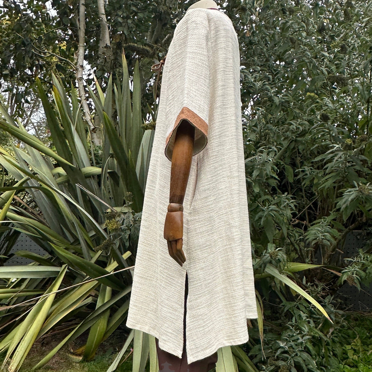 White and brown woven medieval tunic side view for LARP events.