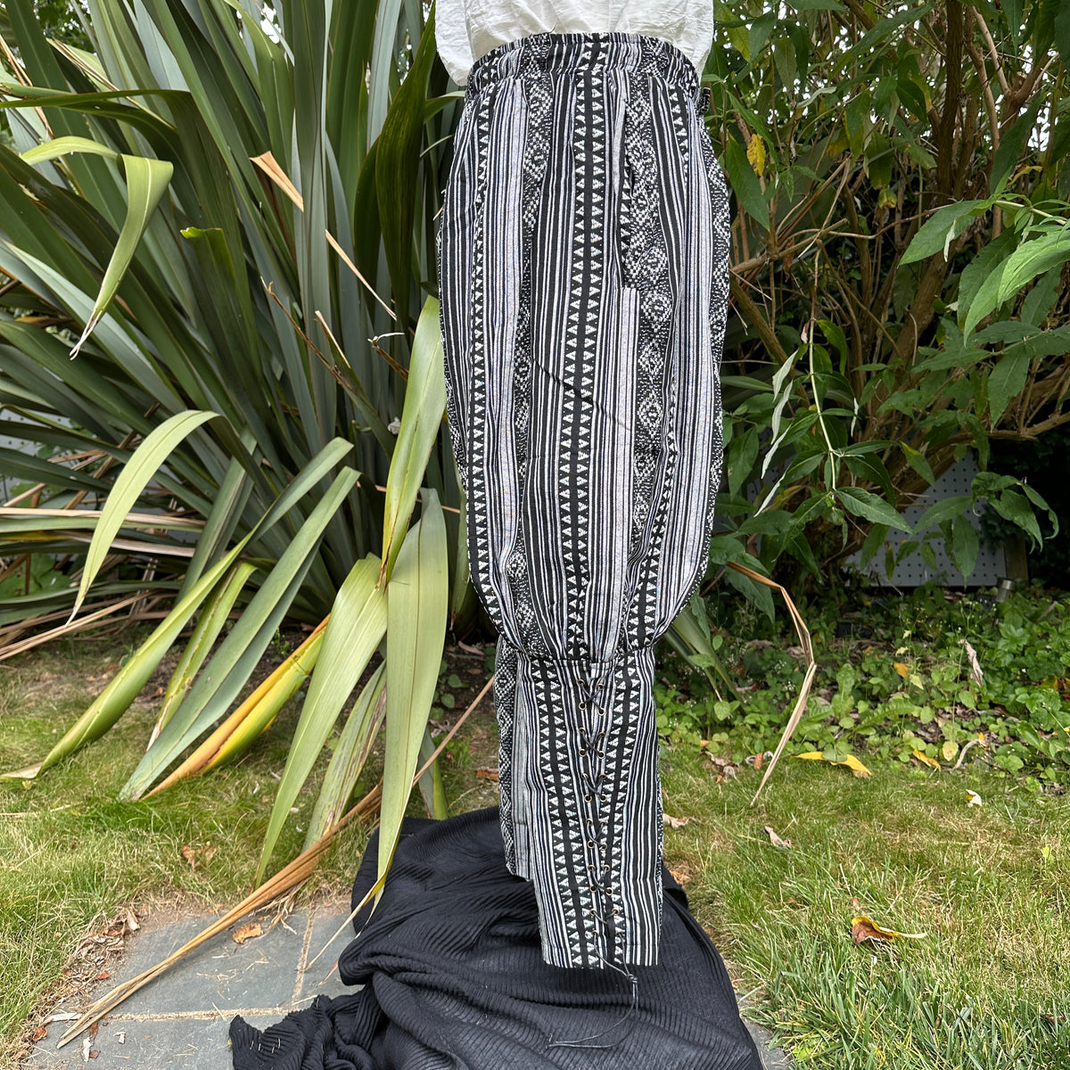 Black and white LARP pants with geometric patterns.