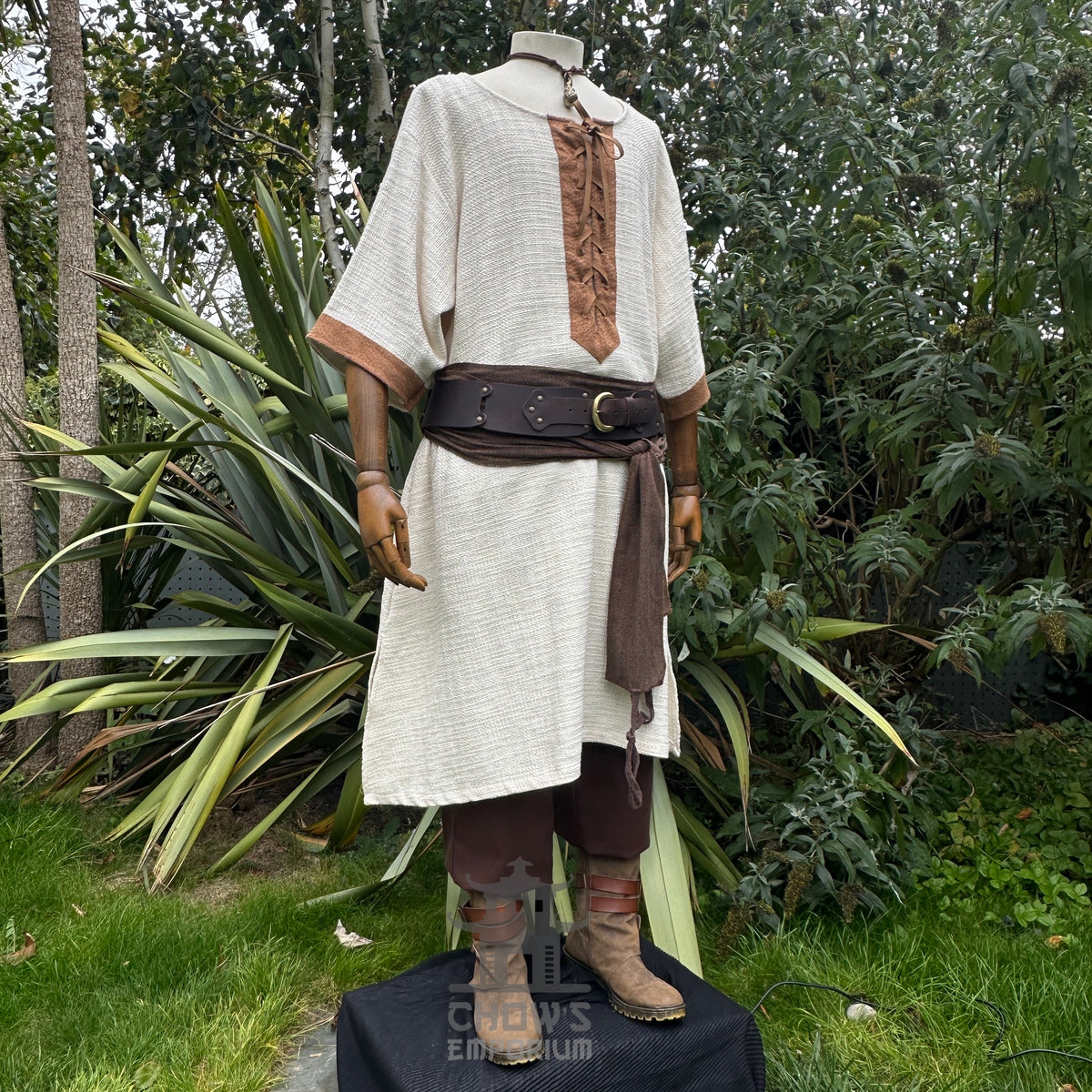 LARP medieval outfit with white tunic, brown sash, and pants on a mannequin.