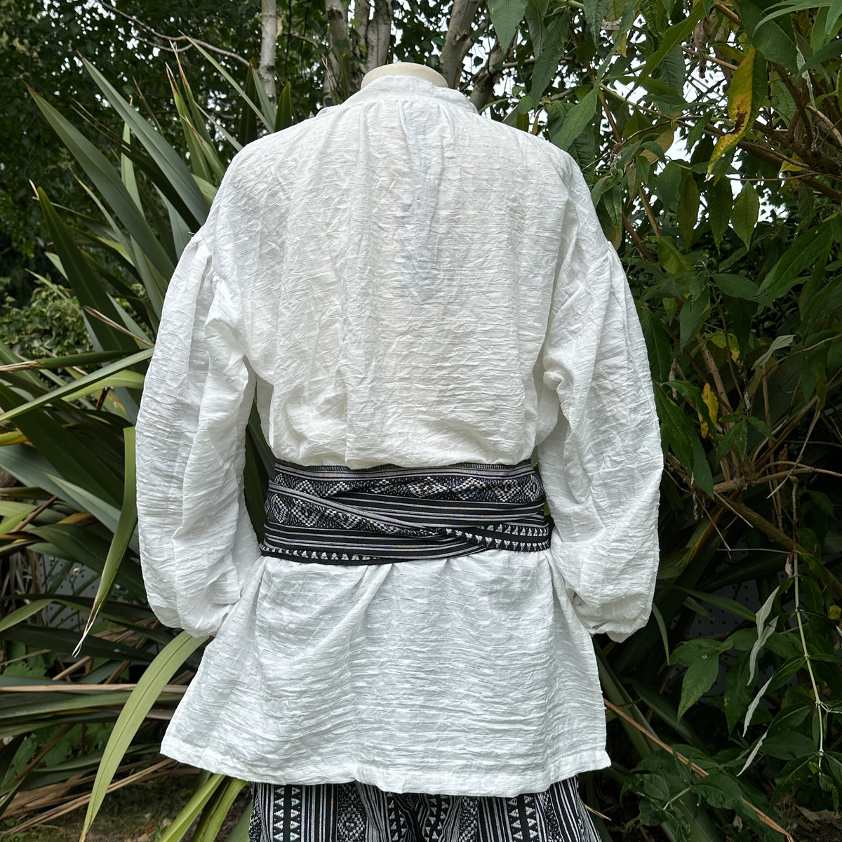 White textured cotton and linen medieval shirt, back view.