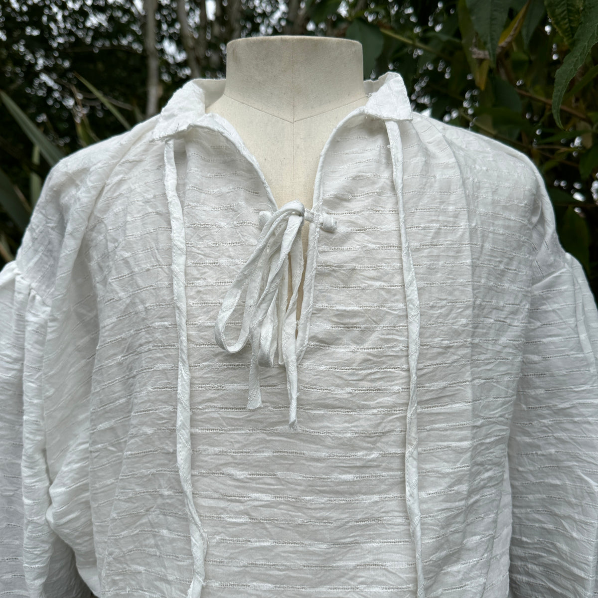 White textured medieval shirt in cotton and linen for LARP, front view.