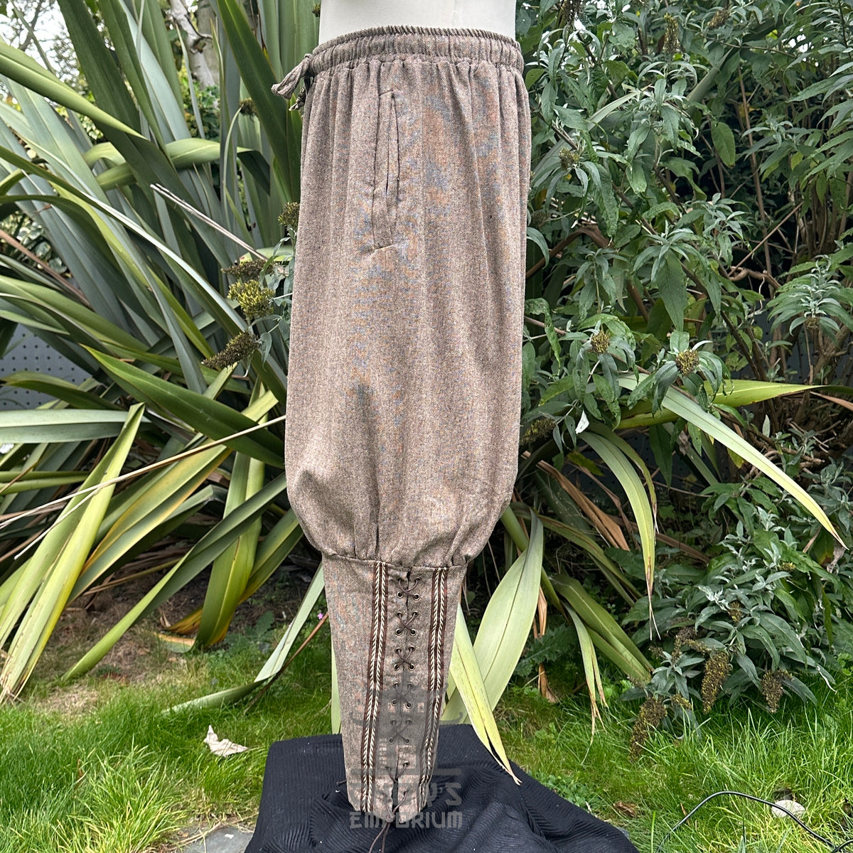 Brown LARP pants with embroidery, side view, textured fabric, medieval style.