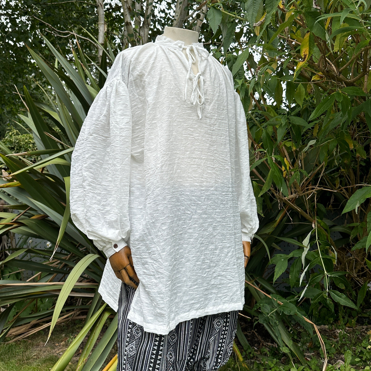 Medieval shirt in textured white cotton-linen for LARP, side view.